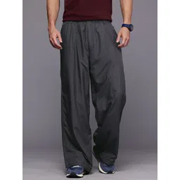 ASICS Unisex Relaxed Fit Side Zip Detail Outdoor Track Pants image 3