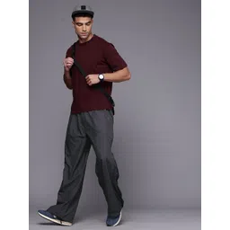 ASICS Unisex Relaxed Fit Side Zip Detail Outdoor Track Pants image 5