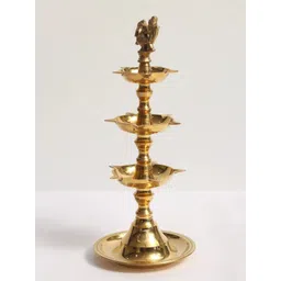 Exotic India Gold Toned Peacock Three-Layer Oil Lamp-image-23