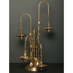 Exotic India Gold Toned Textured Brass Diya-image-26